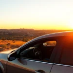 Experience affordable car rental with driver Malta, featuring scenic views and warm sunset lighting.